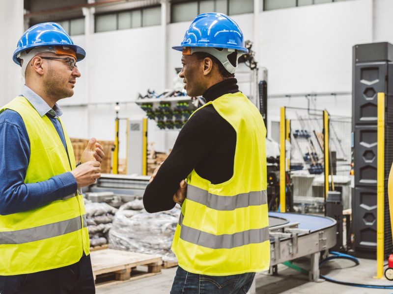 Engineers Having Discussion in Industrial Facility